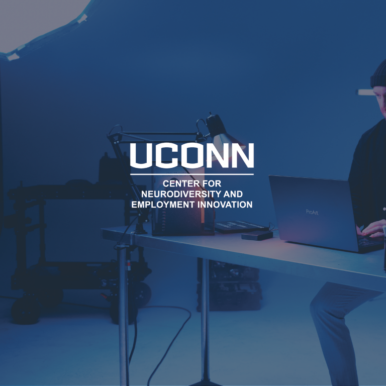 Uconn Neurodiversity Logo with computer desk background